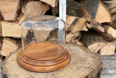 glass holder on wooden plynth